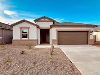Charming single-story home with a two-car garage and low maintenance landscaping at 11948 E Aster Ln, Florence, AZ 85132