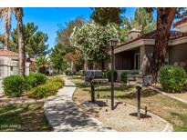 Serene view of the community's meticulously maintained landscaping and available BBQ area at 2929 W Yorkshire Dr # 2074, Phoenix, AZ 85027