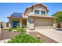 Charming two-story home featuring desert landscaping, a two car garage, and solar panels at 31256 N 40Th Pl, Cave Creek, AZ 85331