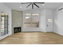 Bright living room with a fireplace, ceiling fan and lots of natural light at 3440 E Southern Ave # 1107, Mesa, AZ 85204