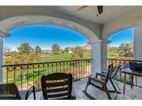 Relax on this balcony with golf course views and wrought iron railings framed by a white archway at 6138 N 28Th St, Phoenix, AZ 85016