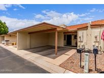 Charming home featuring a carport and well-maintained landscaping at 13408 N 25Th Dr, Phoenix, AZ 85029