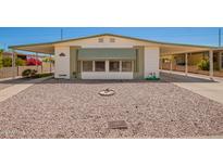 Charming single-story home with rock landscaping and covered parking at 16215 N 35Th Way, Phoenix, AZ 85032