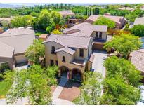 Beautiful two-story home featuring a tiled roof, a charming front porch, and a well-maintained landscape at 20639 W Grandview Dr, Buckeye, AZ 85396