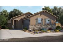Beautiful single-story home featuring stone accents, neutral-colored exterior, desert landscaping, and an attached two-car garage at 316 S San Christo Ln, Casa Grande, AZ 85194