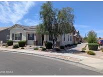 Inviting single-story home with a charming desert landscaped front yard on a sunny day at 324 N 56Th Pl, Mesa, AZ 85205
