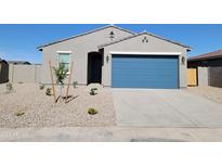 Charming single-story home with a blue garage door and low-maintenance rock landscaping at 335 S San Gregorio Ln, Casa Grande, AZ 85194