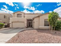 Charming two-story home with desert landscaping and a two car garage at 3680 S Tower Ave, Chandler, AZ 85286
