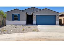 Charming single-story home featuring a blue garage door, neutral color scheme, and low-maintenance front yard at 37357 W San Sisto Ave, Maricopa, AZ 85138