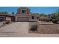 Charming two-story home features a well-maintained yard and a two-car garage at 3765 E Oxford Ln, Gilbert, AZ 85295