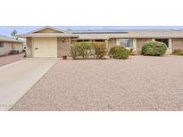 Charming brick home featuring a low-maintenance gravel yard and solar panels at 9814 W Long Hills Dr, Sun City, AZ 85351