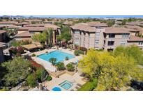 Resort-style pool and spa surrounded by lush landscaping and cabanas, perfect for relaxation at 19777 N 76Th St # 3220, Scottsdale, AZ 85255
