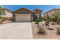 Charming single-story home featuring a two-car garage and desert landscaping in a sunny neighborhood at 3349 E Merlot St, Gilbert, AZ 85298