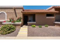 Inviting home entrance with well-maintained landscaping and a charming tiled roof at 501 W Tonopah Dr # 7, Phoenix, AZ 85027