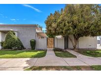 Charming home featuring a private front entrance with well-manicured landscaping and a serene atmosphere at 5025 W New World Dr, Glendale, AZ 85302