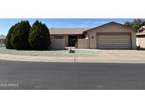 Charming single-level home featuring a well-maintained yard and a two-car garage, ideal for comfortable living at 973 Leisure World --, Mesa, AZ 85206