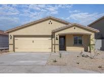 Charming single-story home with a two-car garage and neutral-toned stucco exterior at 1131 W West Virginia Ave, Florence, AZ 85132