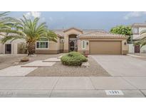 Charming single-story home with desert landscaping and a covered entryway creating curb appeal at 1391 W Windhaven Ave, Gilbert, AZ 85233