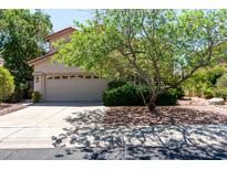 Charming two-story home featuring a neutral color scheme, well-manicured landscaping, and a spacious two-car garage at 21614 N 59Th Ln, Glendale, AZ 85308