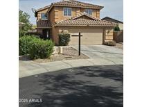 Charming two-story home featuring a tile roof, two car garage and well-maintained landscaping at 22872 W Gardenia Dr, Buckeye, AZ 85326