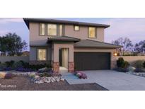 Charming two-story home with brick accents, landscaped front yard and two-car garage at 25130 N 156Th Ln, Surprise, AZ 85387