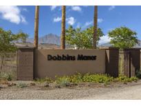 Dobbins Manor community sign with beautiful landscaping and mountain views at 2735 W La Mirada Dr, Laveen, AZ 85339