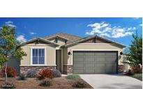 Charming single-story home with stone accents, desert landscaping, and a two-car garage at 4961 W Walatowa St, Laveen, AZ 85339