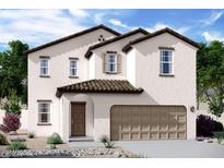 Charming two-story home featuring a stucco facade, tiled roof, arched entry and attached two-car garage at 5830 W Sunrise Dr, Laveen, AZ 85339