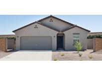 Charming single-story home with a two-car garage and low-maintenance desert landscaping at 5840 W Willow Ridge Dr, Laveen, AZ 85339