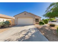 Charming single-story home with a two-car garage, neutral paint, and low maintenance landscaping at 8104 S 73Rd Dr, Laveen, AZ 85339