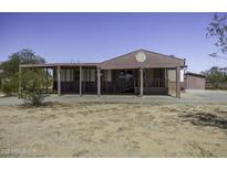 Charming single-story home with covered porch in a rural setting at 10622 N Malachite Way, Casa Grande, AZ 85122