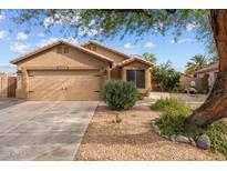 Charming single-story home featuring a two-car garage and desert landscaping for low maintenance at 11405 W Windsor Ave, Avondale, AZ 85392