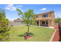 Expansive backyard featuring lush lawn and tasteful landscaping, providing an outdoor retreat at 30375 W Verde Ln, Buckeye, AZ 85396