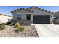 Charming single-story home with a two-car garage and low-maintenance desert landscaping at 3914 E French Trotter St, San Tan Valley, AZ 85140