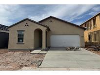 A charming single-story home featuring a neutral stucco finish, tile roof, and an attached two-car garage at 4234 E Kolin Ln, San Tan Valley, AZ 85143