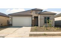 Charming single-story home with a two-car garage and low maintenance front yard at 42900 W Peters Dr, Maricopa, AZ 85138
