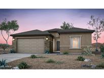 Inviting single-story home featuring a two-car garage and desert landscaping at 42925 W Palo Amarillo Rd, Maricopa, AZ 85138