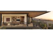A contemporary living room with modern fireplace and sliding doors to a view balcony at 5050 N Camelback Ridge Dr # 1301, Scottsdale, AZ 85251