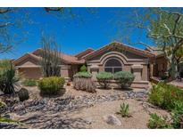 Charming single story home with desert landscaping, gravel, and stone features at 5336 E Gloria Ln, Cave Creek, AZ 85331