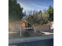 Charming single-story home with a well-maintained yard and attached two car garage at 6159 W Sequoia Dr, Glendale, AZ 85308