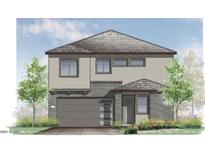 New construction two-story home with gray siding, a modern garage door, and desert landscaping at 670 W Laredo St, Chandler, AZ 85225