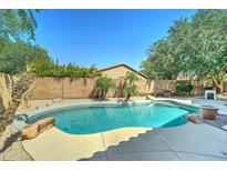 Refreshing backyard pool area with stone accents at 7815 S 22Nd Ln, Phoenix, AZ 85041