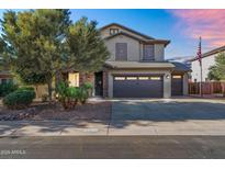 Charming two-story home featuring a two-car garage and desert landscaping at 1974 E Dubois Ave, Gilbert, AZ 85298