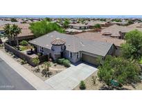 Beautiful single-story home featuring a tile roof, desert landscaping, and a two-car garage at 30285 W Leah Dr, Buckeye, AZ 85396