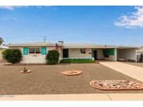 Charming single-story home featuring a low-maintenance yard, covered carport, and stylish curb appeal at 5317 E Colby St, Mesa, AZ 85205
