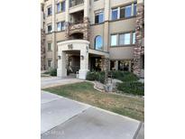 Elegant building entrance featuring stone accents and manicured landscaping, creating an inviting curb appeal at 5350 E Deer Valley Dr # 3267, Phoenix, AZ 85054