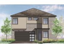 A charming two-story home with a brick and tan stucco exterior and an attached two-car garage at 651 W Laredo St, Chandler, AZ 85225