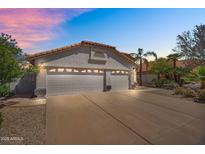 Well-maintained home with a spacious three-car garage and a lovely desert landscape at 7464 E Lompoc Ave, Mesa, AZ 85209