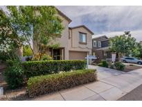 Two-story home featuring manicured landscaping, a two-car garage and sign in the front yard at 8905 W Jefferson St, Tolleson, AZ 85353