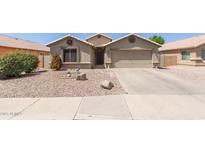 Charming single-Gathering home with desert landscaping and a two-car garage at 1564 E Leaf Rd, San Tan Valley, AZ 85140